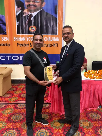 Receiving an award for my contribution as an instructor and official. My commitment extends beyond teaching to helping uphold the standards of karate competition in India.