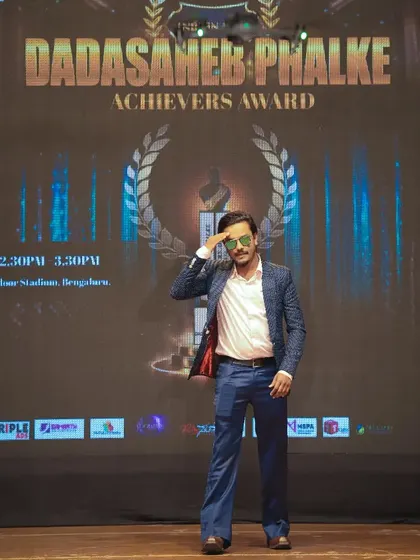 A solo shot on the Dadasaheb Phalke Award stage. This represents the culmination of my role as the show's director, taking responsibility for every aspect of the production.