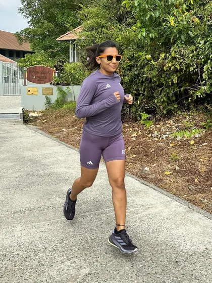 Running in my Adidas Supernova Rise. These shoes are true to size, durable, and provide a soft landing, which is great for heel strikers like me.