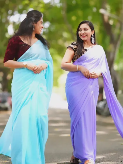 A candid, smiling moment between two models in my trail sarees.