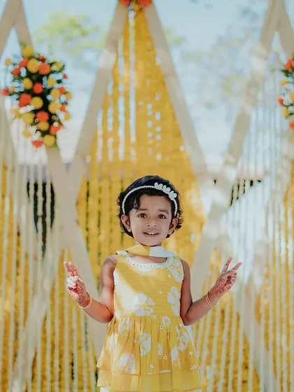 A little guest enjoying the beautiful Haldi decor. It's moments like these that make all the hard work worthwhile.