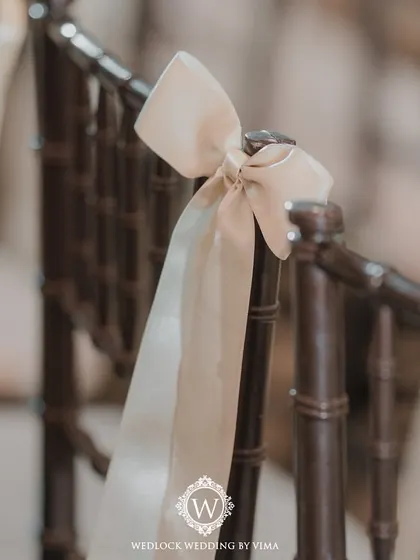 A simple yet elegant reception setup with soft lantern lighting and delicate drapes on the gazebo. The lush purple-themed florals and romantic centerpieces tied the whole look together.