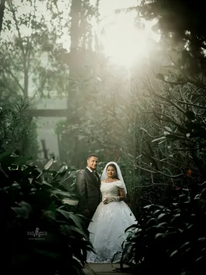 There is a certain magic to a wedding day, a feeling I aim to capture in every frame. This couple, enveloped in the soft morning mist, shares a moment of serene romance. This portrait showcases my approach to creating atmospheric and artistic Christian wedding photography.