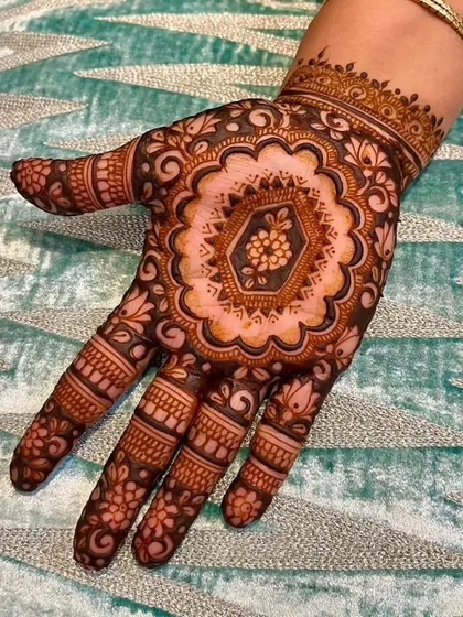 This mandala design is a perfect example of negative space filling. The central floral pattern is highlighted by the dark, filled-in space around it, making the details stand out.