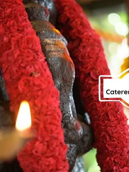 We begin our most important events with a prayer. This image of a deity adorned with flowers reflects our deep connection to the cultural and spiritual aspects of the food we serve.