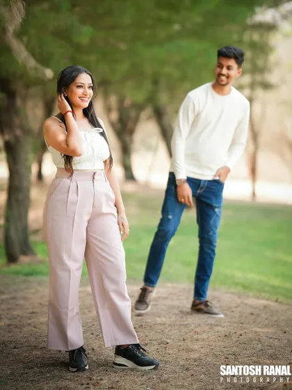 A playful and stylish outdoor portrait of a couple.
