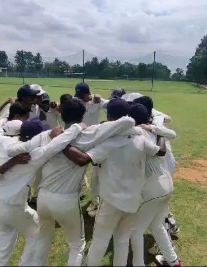 The team huddle before the Save Water Cup final. This moment captures the unity and focus that propelled them to victory.
