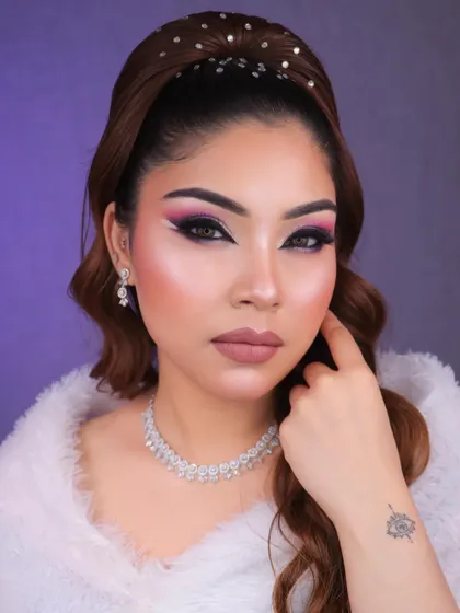 A direct gaze that shows off the full impact of the dramatic and artistic eye makeup.