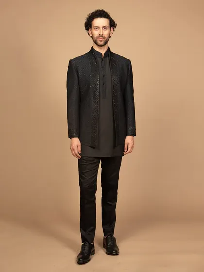 A full-length view of the black embroidered Bandhgala set. This outfit is a perfect fusion of tradition and modernity, designed to make a powerful statement.