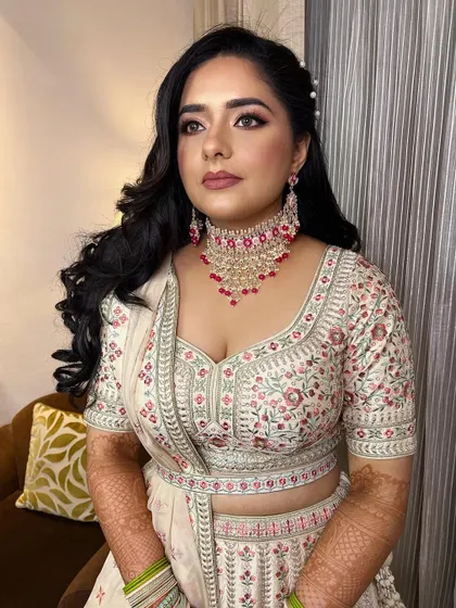 A beautiful soft glam look for an engagement ceremony. I focused on creating a flawless base, soft smokey eyes, and a neutral lip to let her natural beauty shine.
