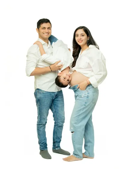 I love capturing playful, unposed moments like this. The father holding his son upside down brings genuine laughter and energy, showing the fun side of this growing family.