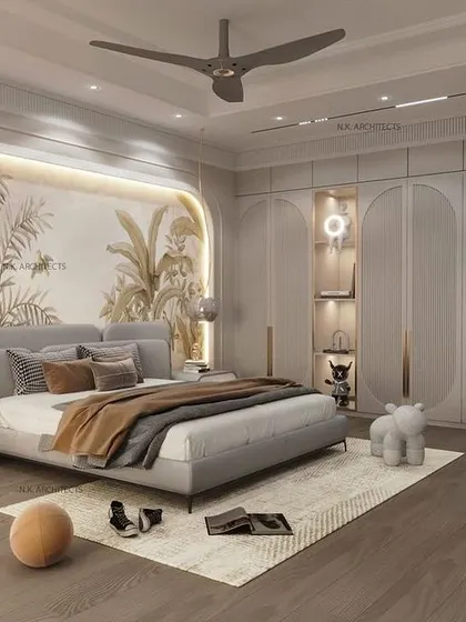 A wider view of the bedroom with the wallpaper mural, showing the full expanse of the custom wardrobes with their unique curved design. The room feels spacious, calm, and full of personality.
