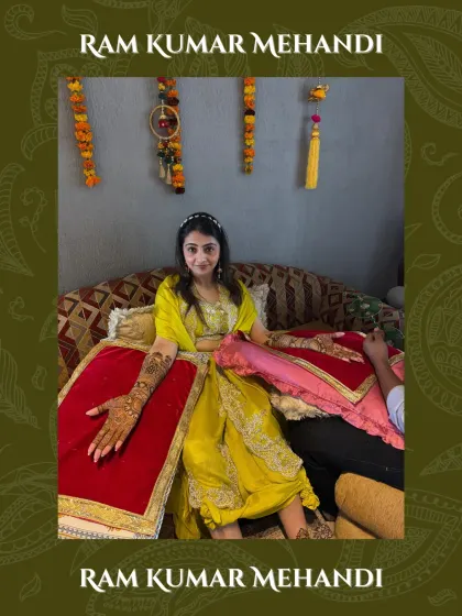 A beautiful shot of a bride with her arms outstretched, showing off the full extent of her intricate bridal mehandi.