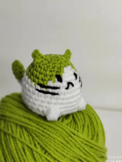 A green and white version of the mini cat plushie.