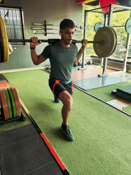 A barbell lunge in progress, showing a more advanced progression for building serious leg strength and power.