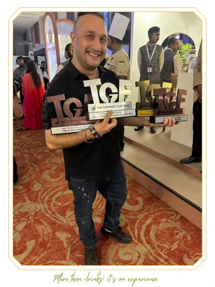 Our founder proudly holding the trophies from The Gourmet Fest 2025. These awards celebrate our passion for innovation and the artistry of cocktails.