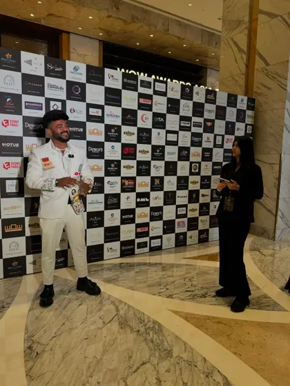 Giving an interview on the red carpet at the WOW Awards.