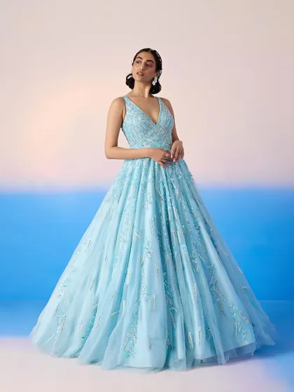 A stunning powder blue ballgown with intricate silver embellishments, a true princess moment for a grand reception.