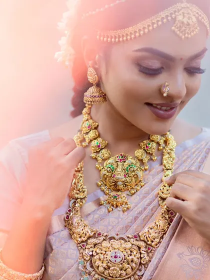 A dreamy, soft-focus shot of a model in a traditional muhurtham look.