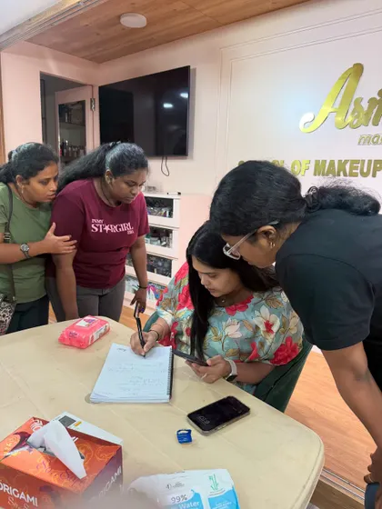 My students gather around to take detailed notes as I explain the product selection and step-by-step process for creating a flawless base.