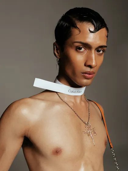 A close-up portrait showcasing the custom choker and a cross necklace. This highlights my attention to detail in accessory styling to build a specific character and mood.