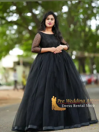 A full standing view of the black tulle ball gown.