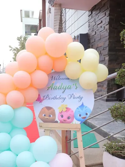 A charming welcome sign and balloon arrangement at the entrance of a Katuri-themed party. It's a great way to greet guests and set the tone for the celebration.