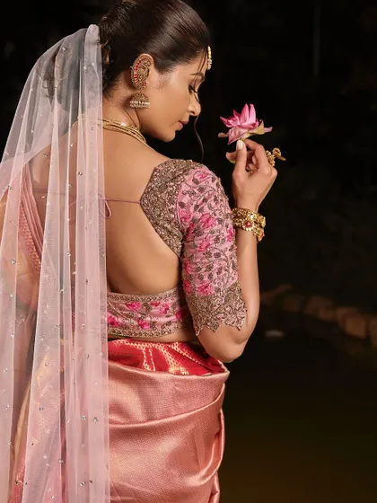 The back view of this stunning look, showing the elegant hairstyle and the beautiful drape of the veil.