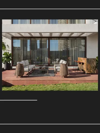 A graphic-style image showing the outdoor terrace of the House of Terraces, a key feature of the home which was designed from a bare concrete shell.