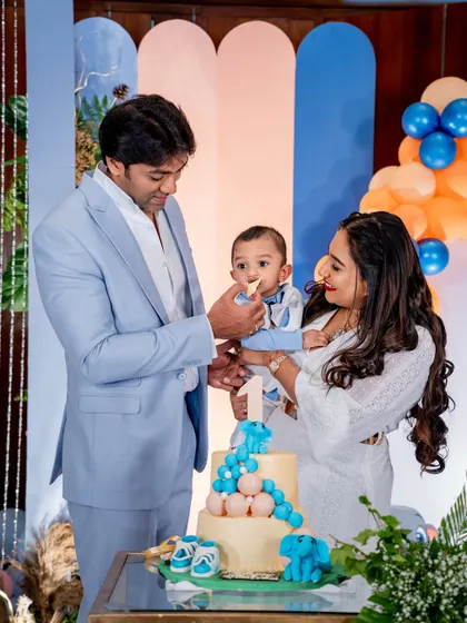 The cake cutting is a highlight of any first birthday. We captured this sweet moment as the parents help their little one have his first taste of birthday cake.