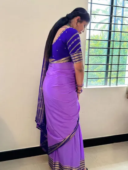 The back view of the lavender Mysore crepe silk saree, showing the beautiful fall of the fabric and the elegant border on the pallu.