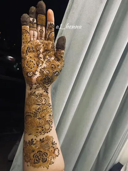 A close-up of the intricate work on one arm, showcasing the variety of patterns used.