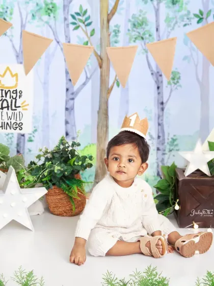Wearing his first birthday crown, this little prince is ready for his royal celebration in our wild one themed setup.