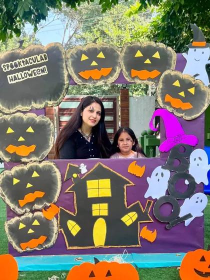 A mother and daughter share a smile at our Halloween workshop. We aim to create a fun and welcoming atmosphere for all our families.