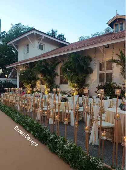 Another view of the candle-lit walkway, showing how it illuminates the guest seating area. The warm, flickering light creates an incredibly intimate and dreamy ambiance.