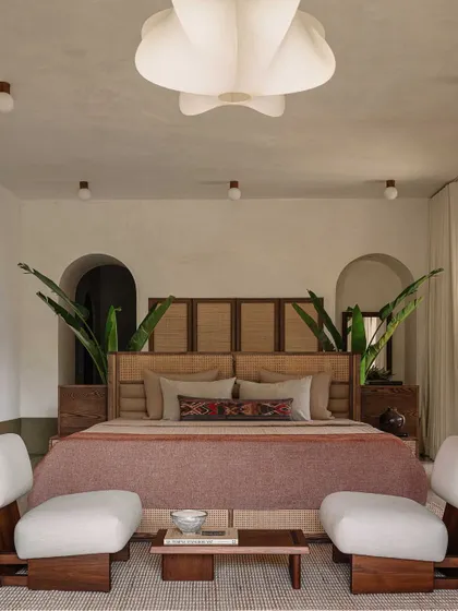 In this bedroom at the DUA Villa, we demonstrate how grand architectural concepts can translate into serene, intimate spaces. The design frames the view, making the lush exterior an integral part of the room's calm and restorative atmosphere.