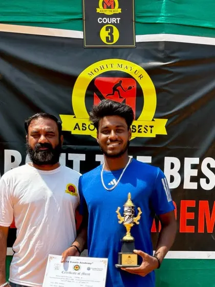 A proud moment for a singles finalist at our academy's tournament. The competitive fire in these matches is what helps players grow.