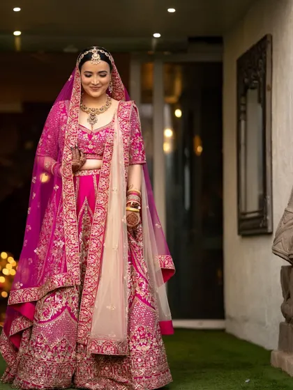 An elegant portrait of the bride, her gentle smile and beautiful attire captured in soft, flattering light.