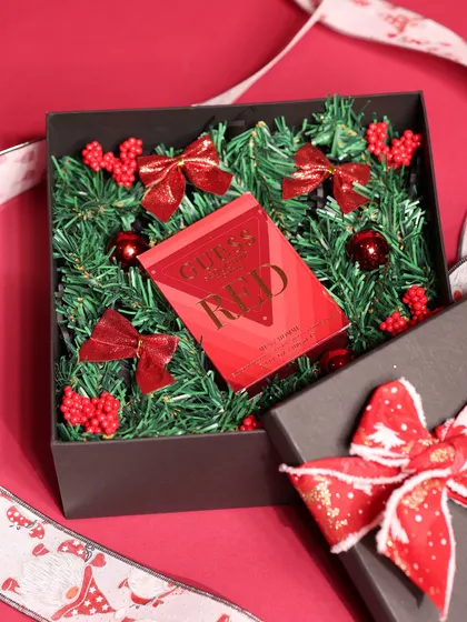 Another view of the Guess perfume hamper, showing the box and festive ribbon.