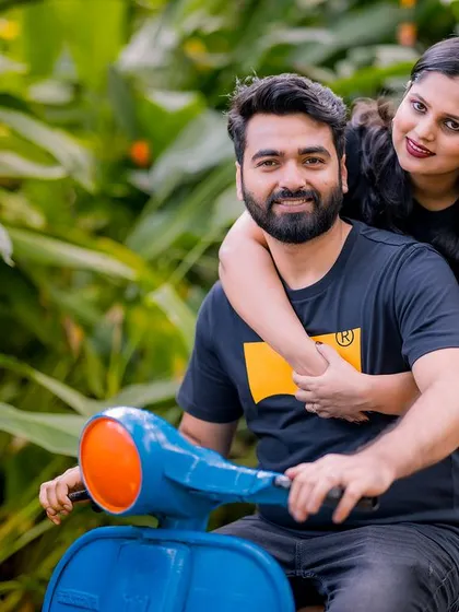A fun and playful portrait on a vintage-style scooter. This shot is full of personality and captures the couple's fun-loving spirit.