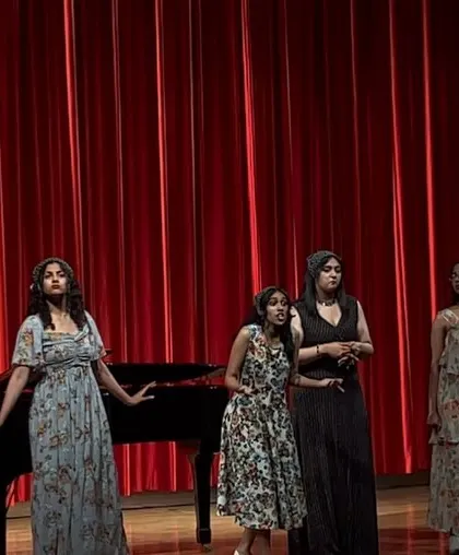 Singing with my friends during our graduation concert. My classical training has taught me so much about harmony and ensemble performance.