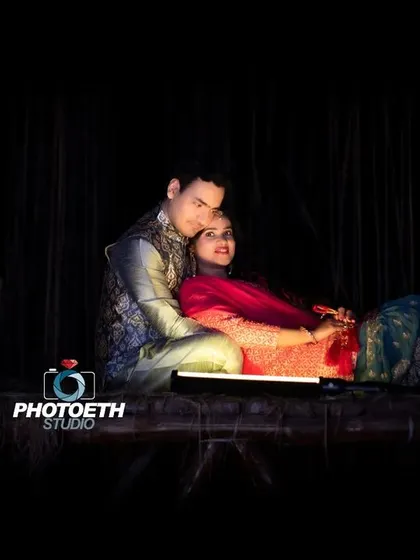 Another intimate moment from the same lantern-lit setting, capturing the couple in a relaxed and loving embrace.