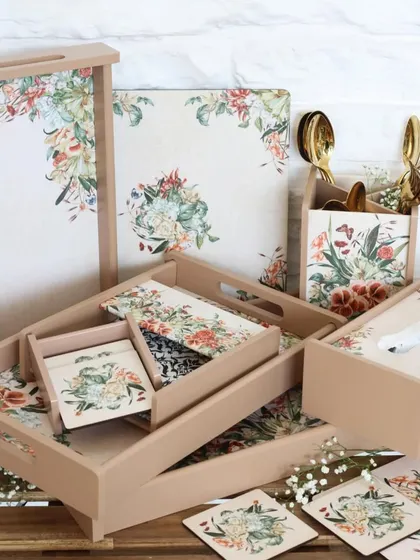 Our floral collection, featuring a beautiful assortment of matching trays, coasters, placemats, and holders. The soft, neutral tones and delicate floral print bring a timeless elegance to any space.