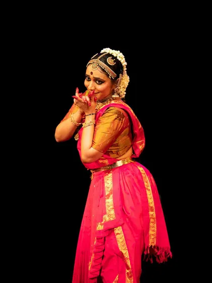 A close-up of Meera Krishna's expressive face during her performance.