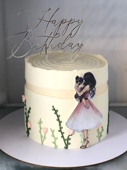 A beautiful cake celebrating the bond between a mother and child, with a delicate illustration and hand-piped flowers.