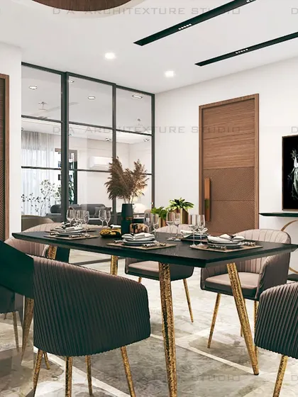 This dining area in Meera Bagh was designed for a client who wanted a fusion of edgy sophistication and luxury. I used black louvers and modern sculptures to create a dramatic and exquisite look.