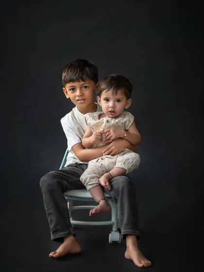 A simple, classic portrait of two brothers. Capturing the protective and gentle nature of an older sibling is always a heartwarming experience.