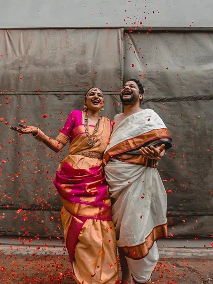 A moment of pure joy as a couple is showered with flower petals. Their unrestrained laughter makes this an incredibly heartwarming and dynamic photograph.