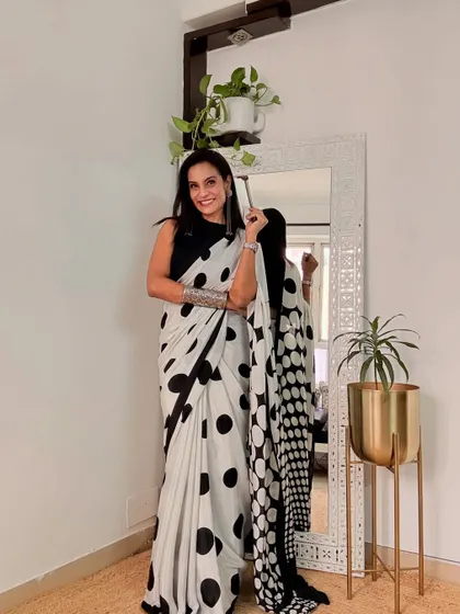 This black and white polka dot saree is a fun and retro piece. It's a classic print that never goes out of style.