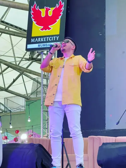 Singing my heart out at the Phoenix Marketcity mall. Performing in public spaces with my band allows me to connect with a diverse audience and share my passion for music.